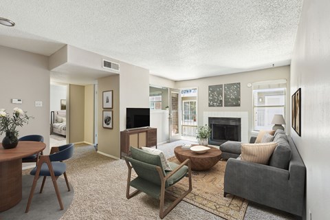 a living room with a couch and a fireplace